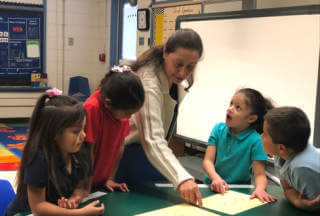 Teacher teaching students in a classroom