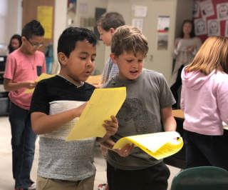 Two student performing activity in classroom