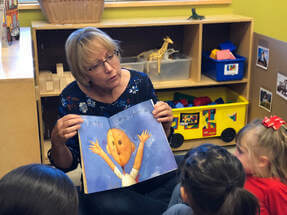Teacher sharing a story in classroom