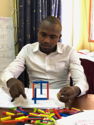 Man sitting working on a puzzle