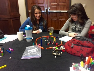 Two women looking at a puzzle