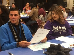 Two young adults in a classroom