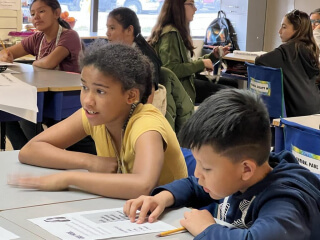 Students laughing in a classroom